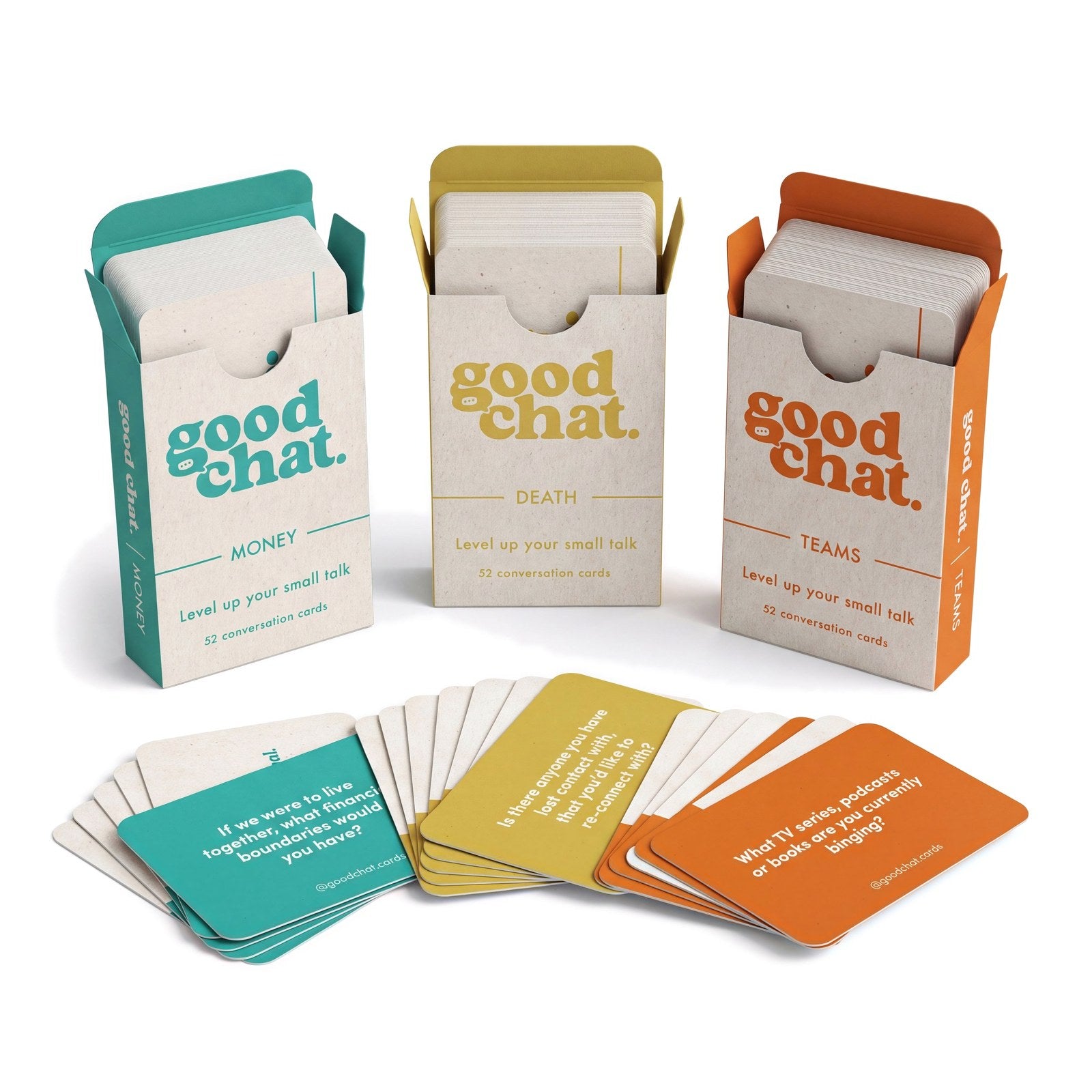 Open Money, Death and Teams decks with conversation cards fanned in front showing deep questions