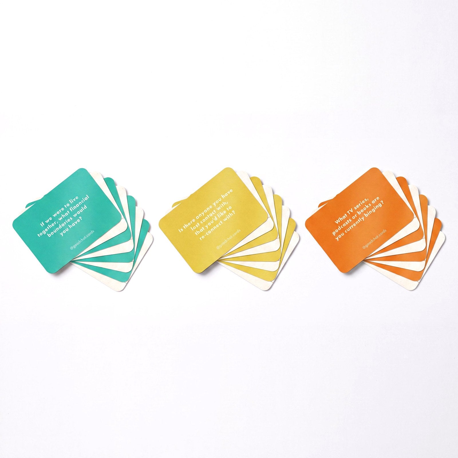 Three fans of Money, Death and Teams conversation cards with icebreaker questions